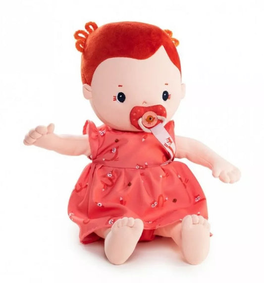 A Lilliputiens Rose Doll 36cm with a pacifier in its mouth.