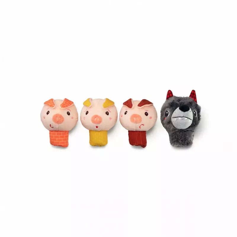 Four whimsical Lilliputiens Louis The Wolf And The 3 Little Pigs Finger Puppets in a row, each with a distinct expression, followed by a contrasting plush figure resembling a grey wolf with a sly grin.