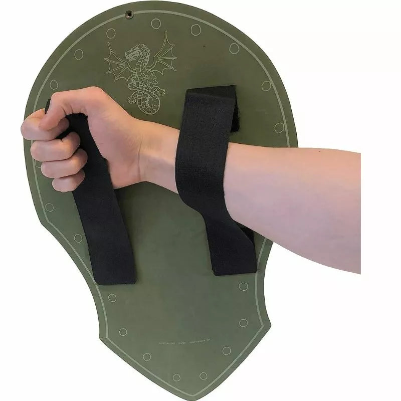a person holding a Liontouch Dragon Shield with black straps on it.