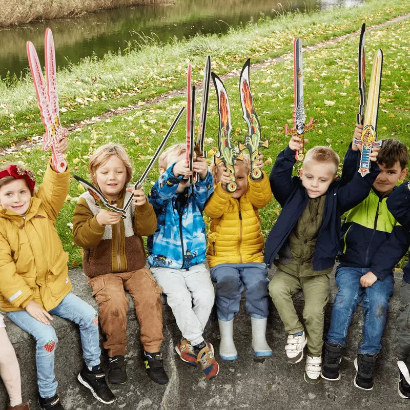 A group of children holding Liontouch Mixed Swords set of 6 in front of a river.