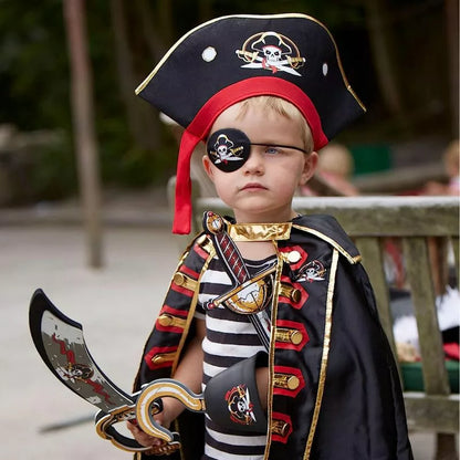 a young boy dressed as a Liontouch Pirate Hook Captain Cross holding a sword.