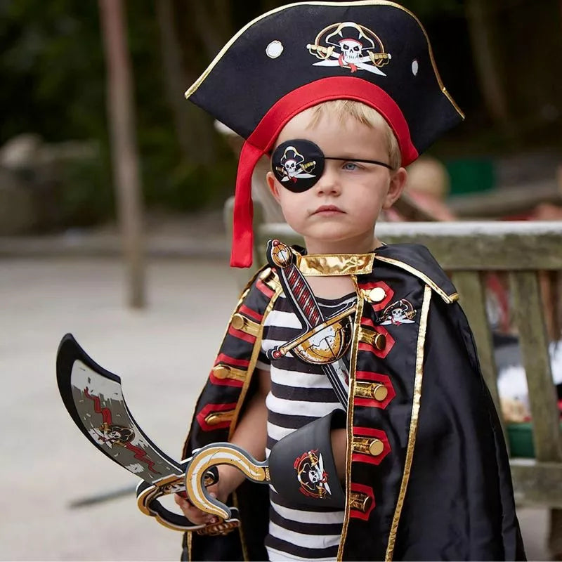 a young boy dressed as a Liontouch Pirate Sabre Captain Cross holding a sword.
