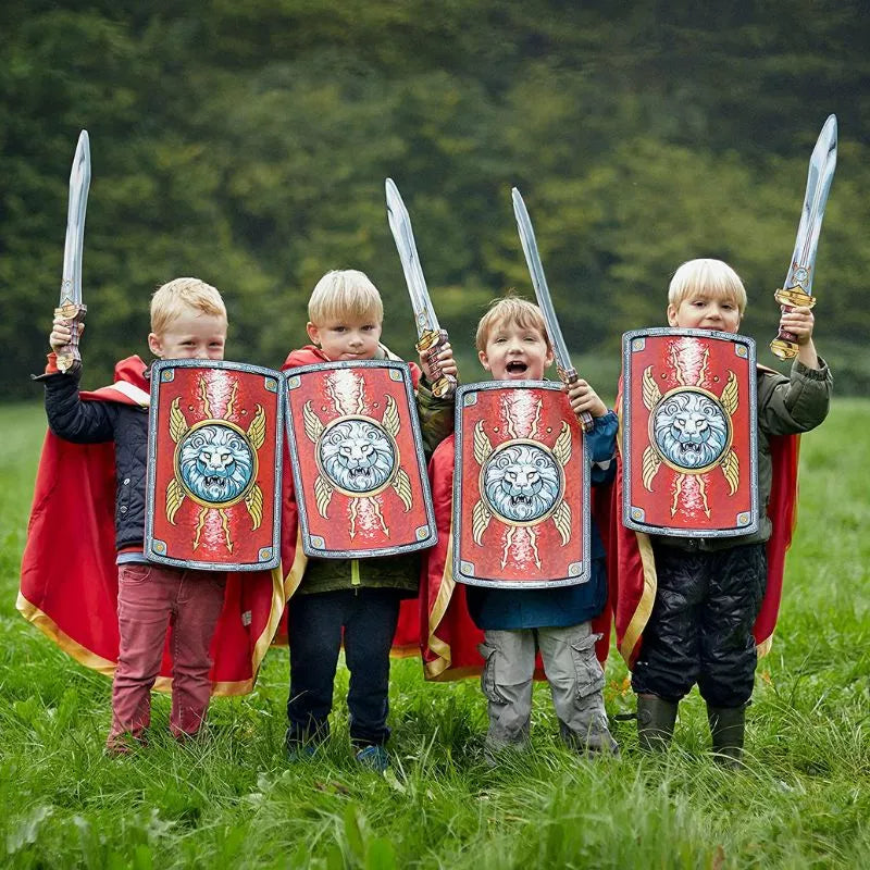 Four children dressed as romans holding Liontouch Roman Swords in a field.