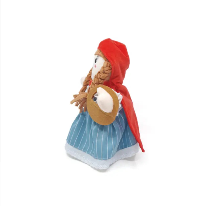 The Hand Puppet Little Red Riding Hood features a fabric doll in a red hooded cape, blue and white striped dress, and holding a small brown basket—perfect for creative storytelling and imaginative play.
