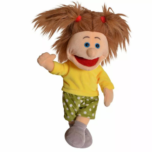A cheerful Living Puppets Hanne Hand Puppet with brown hair in pigtails, wearing a yellow shirt, green polka-dotted shorts, and gray shoes, waves hello.