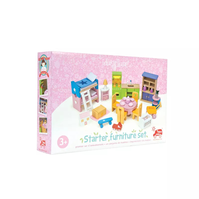 A box with the Le Toy Van Starter Dollhouse Furniture Set inside of it.