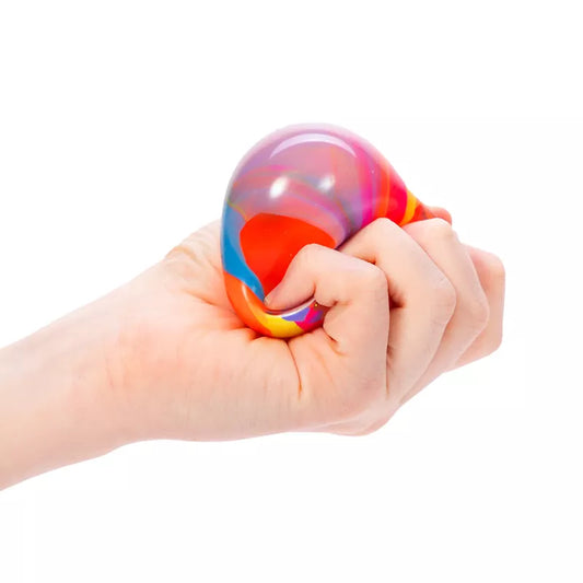 A hand squeezing a colorful Marbleez NeeDoh stress ball against a white background.
