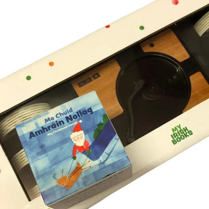 Enjoy "Mini Discs 16 Christmas Songs"—a box set by My Irish Books featuring 16 Irish language Christmas songs, a festive Santa-and-reindeer cover, and a mini gramophone for a unique audio experience.