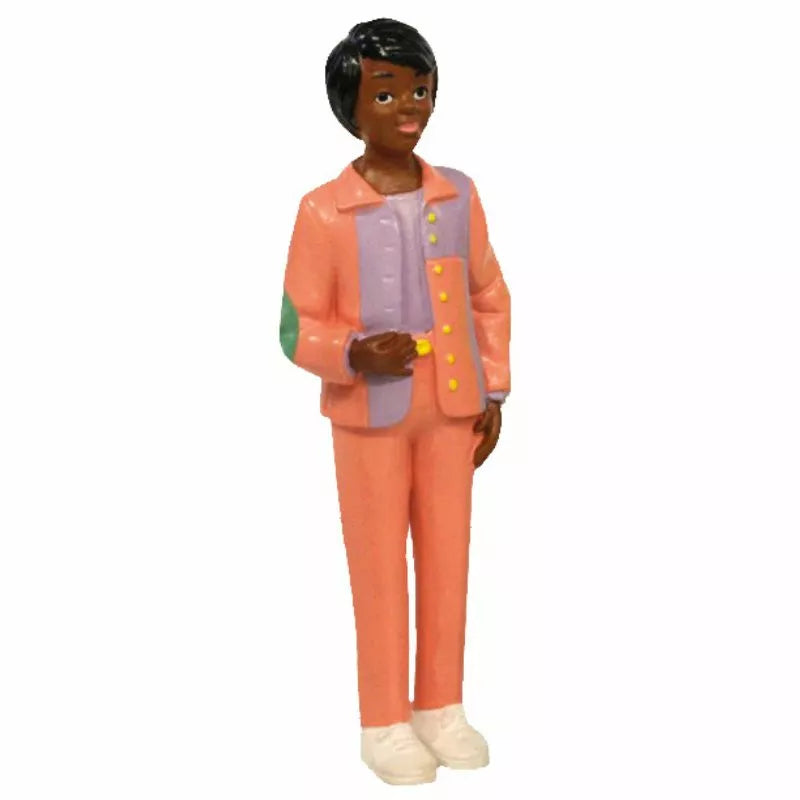 A Miniland Figure representing an African woman in an orange suit.