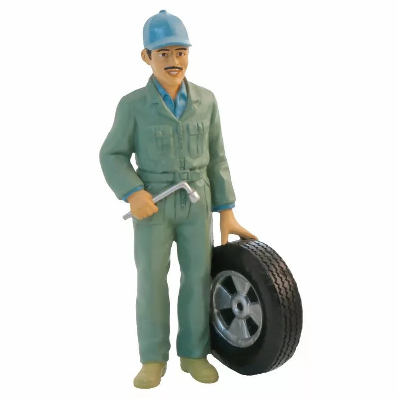 A Miniland Figures Professions figurine of a man holding a tire.