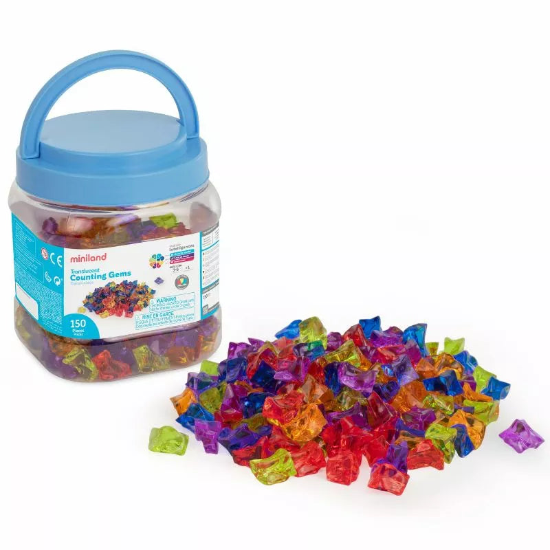 a jar of Miniland Translucent Counting Gems next to a pile of colorful candies.