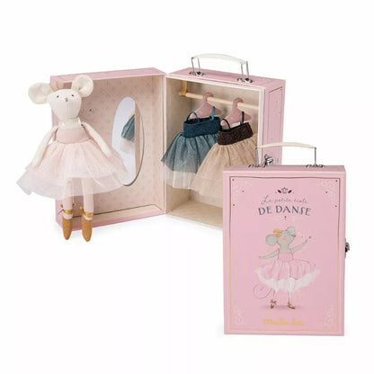 a Moulin Roty Tutu Suitcase with a doll inside of it.