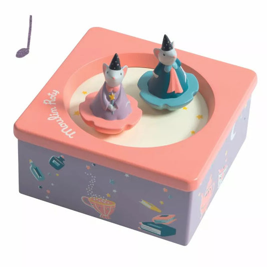 A Moulin Roty Musical Box Once upon a Time with a pair of figurines sitting on top.