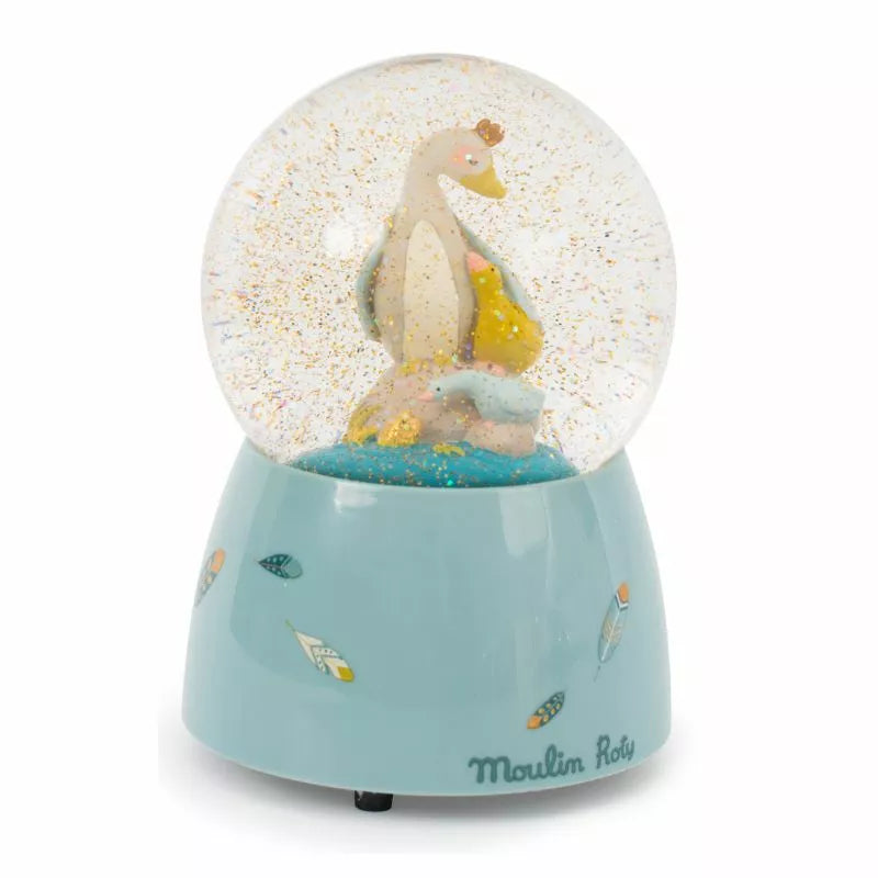 A Moulin Roty Musical Snow Globe Olga’s Journey with a duck inside of it.
