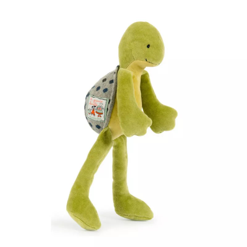 A Moulin Roty Camille Soft Toy with a backpack on its back.