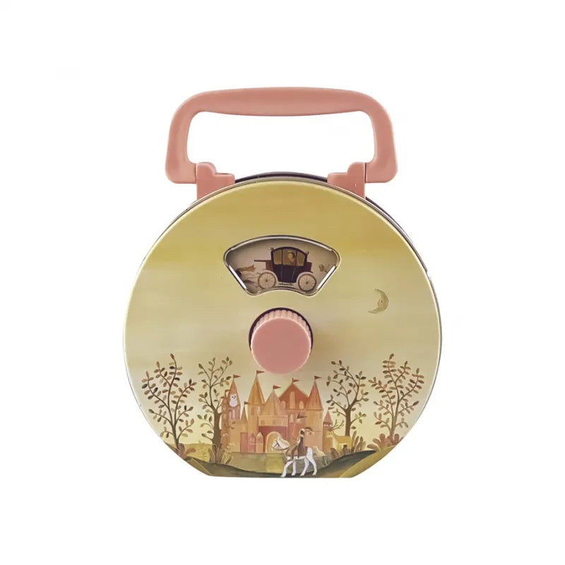 This Musical Radio Princess is a traditional tin toy with a fairytale-themed design, showcasing a castle, trees, a horse, and a carriage set against a yellow background. It includes a pink handle and key for winding up enchanting melodies.