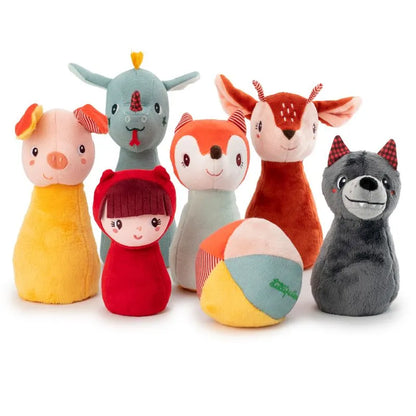 The Lilliputiens I'm Exploring My First Bowling Pins Forest set features colorful, plush toys including a pig, elephant, fox, deer, girl, and wolf with a multicolored ball. Perfect as a baby's first toy or gift, each soft and round-shaped character has friendly features arranged closely together.