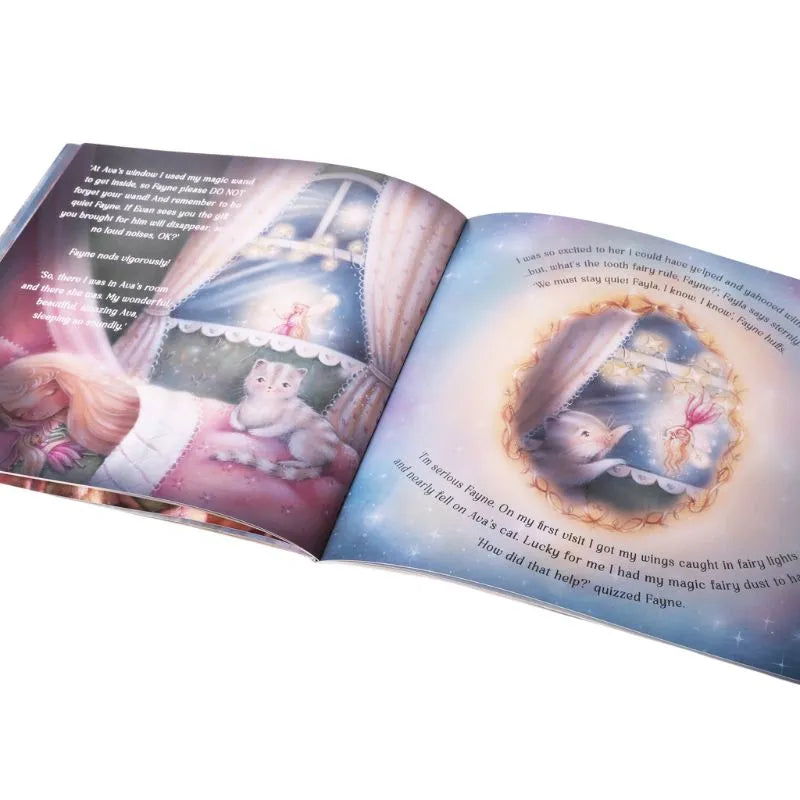 An open "My Forever Tooth Fairy Gift Set" children's book with illustrated pages shows a girl looking out a window with a cat and a fairy on one page—a beautiful display of children's imagination. The other page features text and a circular illustration of a fairy surrounded by soft pastel colors.