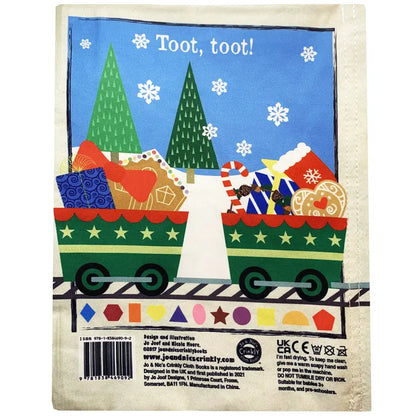 Two green train cars filled with gifts and toys travel on snowy tracks in this festive scene, with pine trees and falling snowflakes. Crinkly Cloth Book Christmas Shapes is a charming holiday gift for any cloth book lover!.