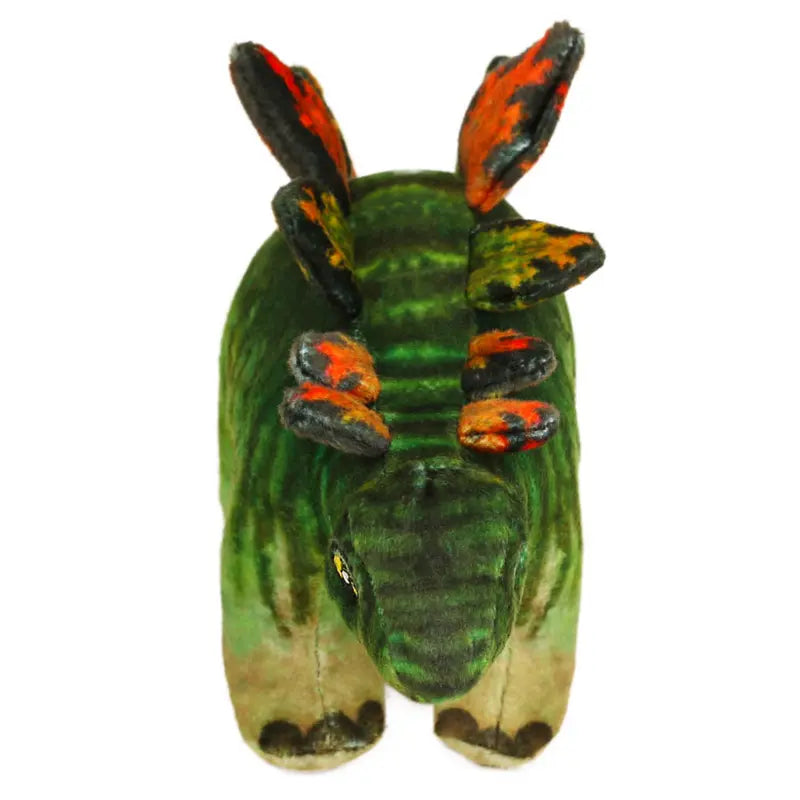 The Natural History Museum Small Stegosaurus Soft Toy is a green plush with orange and black plates, shown facing forward on a white background—ideal for dinosaur fans or Natural History Museum collectors.