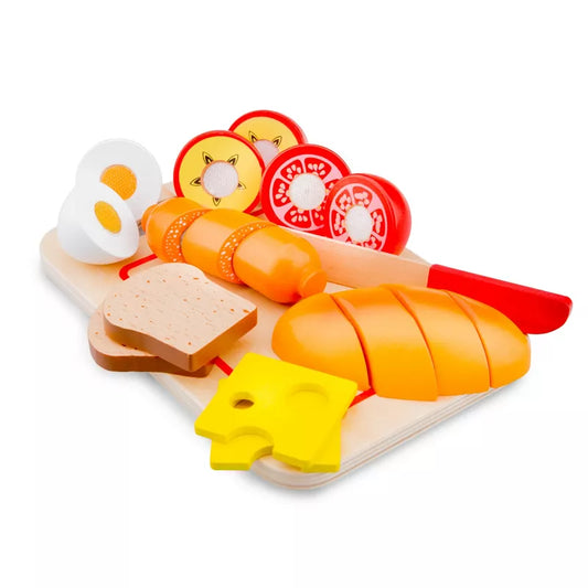 A New Classic Toys Cutting Meal Breakfast board topped with different types of food.