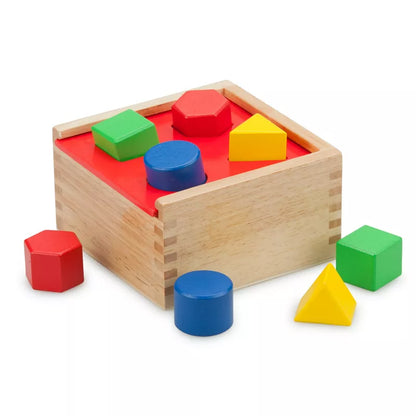 A wooden New Classic Toys Shape Sorting Cube with colorful shapes and shapes.