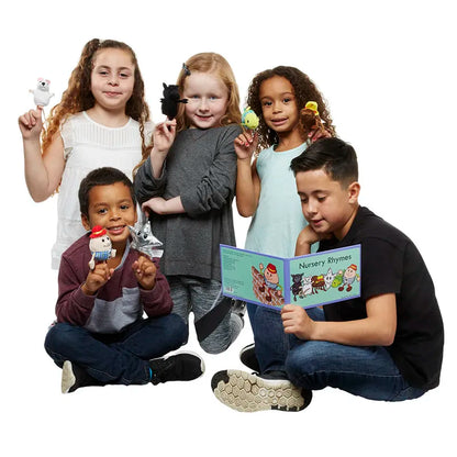 Five children gather, engaged and happy. One of them reads a book of nursery rhymes while animating the tales with "The Puppet Company Finger Puppet Story Set - Nursery Rhymes." Meanwhile, the others hold stuffed animals and small figurines, immersing themselves even further into their storytelling adventure together.