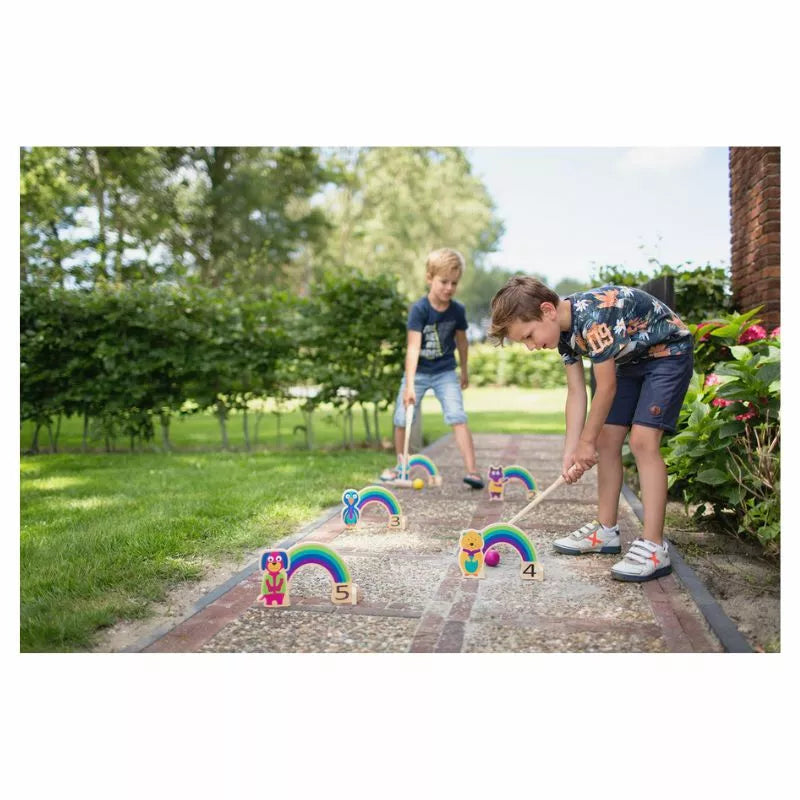 Two young boys playing with the Buitenspeel Rainbow Croquet.