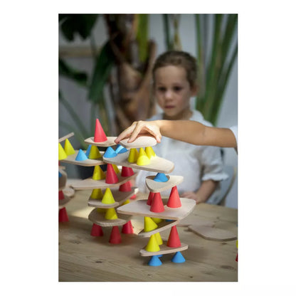 A young girl is playing with a Piks Construction Big Kit – 64 pieces.