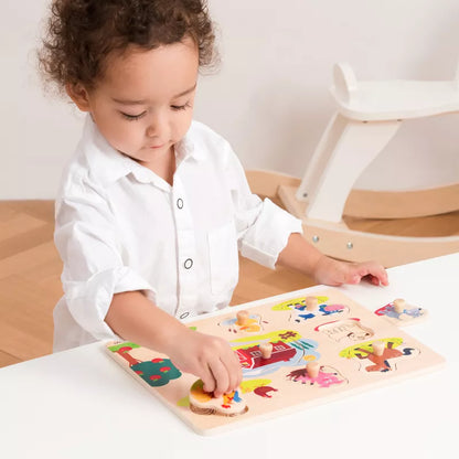 A little girl playing with a New Classic Toys Peg Puzzle – Farm - 8 pieces.