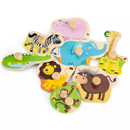 A pile of New Classic Toys Peg Puzzle - Safari - 8 pieces with animals and giraffes.