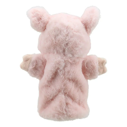 The ECO Puppet Buddies Pig Hand Puppet is shown from behind, featuring fluffy pink fur and outstretched arms with beige paws. The pig has two round ears and an overall delightful appearance, perfect for imaginative play as a charming farm animal toy.