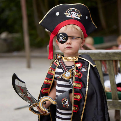 A little boy, aged 3-8 years, dressed in a pirate costume complete with a Liontouch Pirate Hat Captain Cross as the perfect dress up accessory.