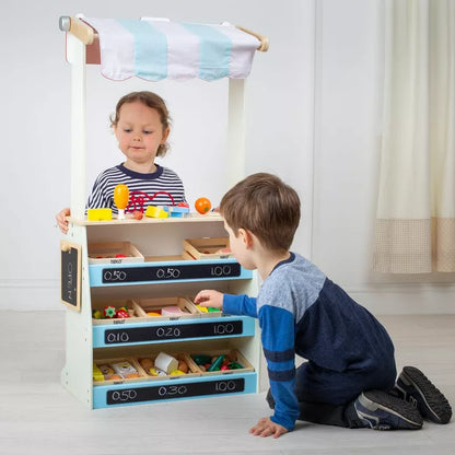 Two children playing with a Tidlo Playshop and Puppet Theatre.