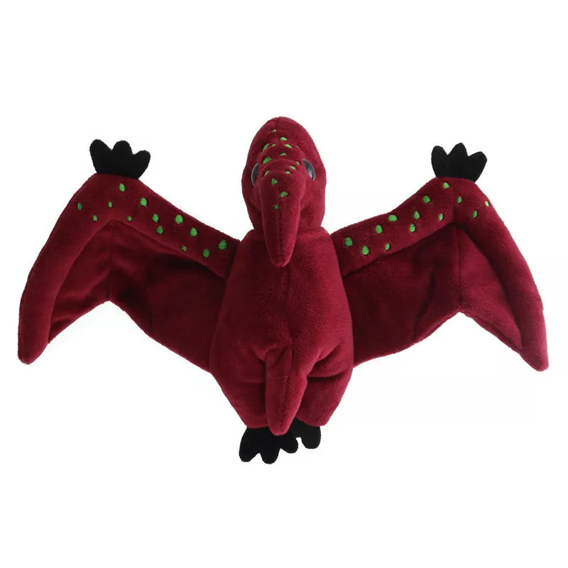 A stuffed Wilberry Time for Stories – Pterodactyl, the perfect storytime companion for dinosaur lovers. This adorable puppet has mesmerizing green eyes that captivate young imaginations.