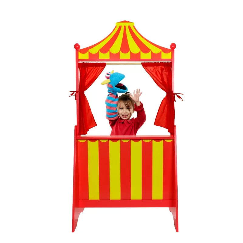 a child in The Puppet Company Puppet Theatre with a stuffed animal.