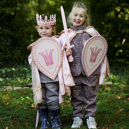 Two children dressed as princesses, wearing the Liontouch Queen Rosa accessory set sword, shield, and crown AS SEEN ON THE LATE LATE TOY SHOW, pose for a photo with their toy EVA foam crown.