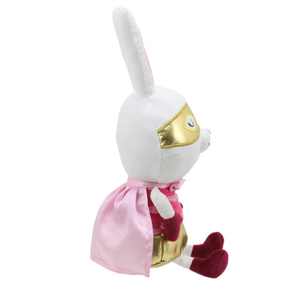 A side view of a stuffed white rabbit wearing a pink and gold superhero costume, including a mask and a cape. The rabbit is sitting upright, its ears standing tall, and its feet are covered in red boots. Perfect for imaginative play, this Wilberry Super Hero Rabbit also makes an excellent birthday present.