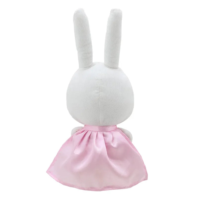 A plush Wilberry Super Hero Rabbit with two long ears is seen from the back, wearing a shiny pink dress. Perfect for imaginative play, the toy has a simple and cute design with no visible facial features from this angle. It makes an adorable birthday present for children of all ages.