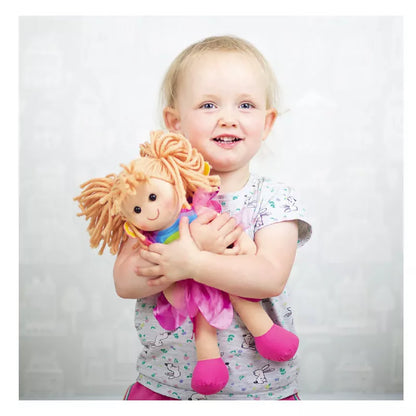 A little girl holding a Bigjigs Chloe Doll Medium stuffed animal.