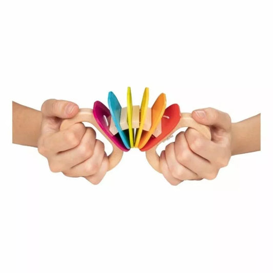 A group of people holding Rainbow Rattles in their hands.