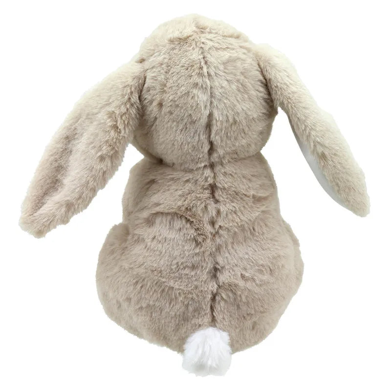 Rosie the Rabbit ECO Cuddlies, a plush brown rabbit with long floppy ears and a small white tail, is seen from behind. Its cozy, soft fur contrasts against a plain white background. Made from recycled materials, this Wilberry toy is sustainable and adorable.