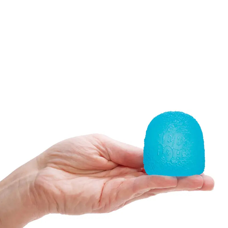 A hand holds a bright blue, semi-transparent Gumdrop NeeDoh fidget toy with a textured surface and "ICE POP" on the front for stress relief, set against a white background.