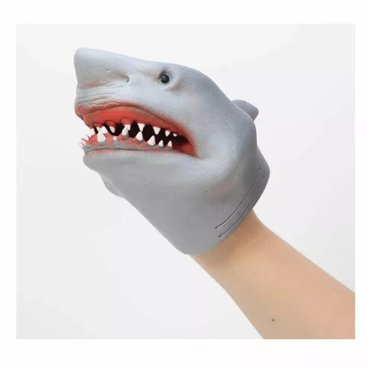 Sentence Revised: The Schylling Shark Hand Puppet wearing a mask with teeth.
