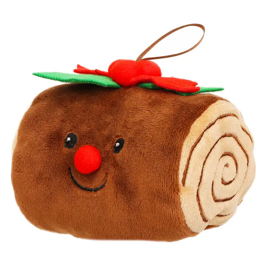 The Yule Log Finger Puppet Decoration is a plush toy designed to look like a festive yule log cake, featuring a smiling face, red nose, and green and red felt holly leaves on top—perfect for imaginative play or as a whimsical Christmas tree ornament.