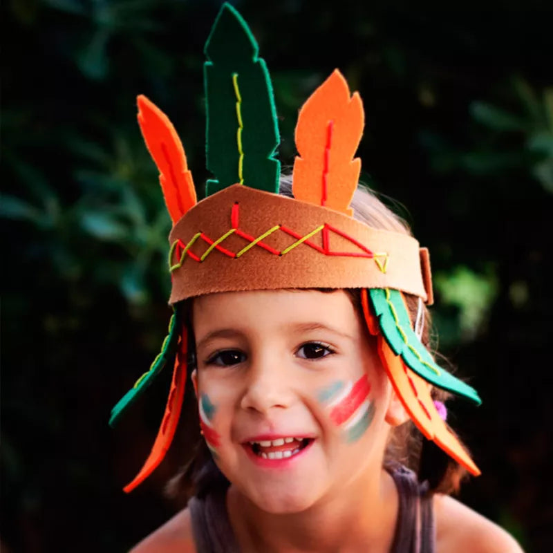 a little girl wearing a native american headdress.