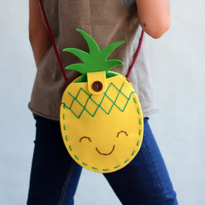 A woman wearing a Bag Sewing Kit Pineapple.