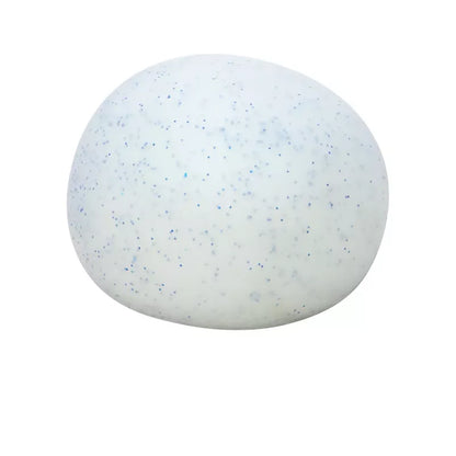 A Snow Ball Crunch Needoh isolated on a white background, displaying tiny blue and black specks scattered across its surface, made of non-toxic materials.