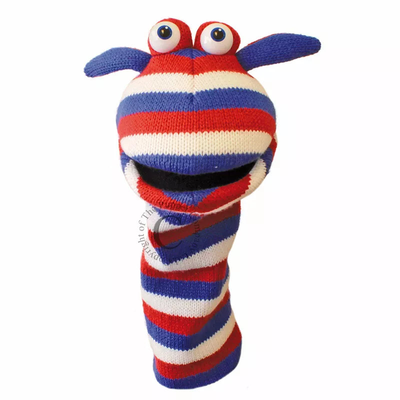 A colourful Sock Puppet named Sockette Puppet Jack It’s knitted body is red and blue. It has big expressive eyes and is mouth moving.