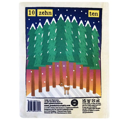 Illustration from Crinkly Cloth Book Count To 10 In German: ten tall pine trees in snow with a deer, the numbers “10,” “zehn,” and “ten” at the top as snowflakes fall from a dark blue sky. Perfect for learning to count in German.